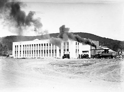 CSIR Offices and Laboratories Building with steam shovel and trucks. Clunies Ross Street, Black Mountain
