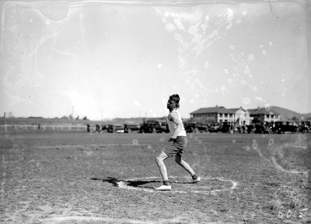 Discus thrower in action at the Canberra Grammar School Sports Day at Manuka Oval.