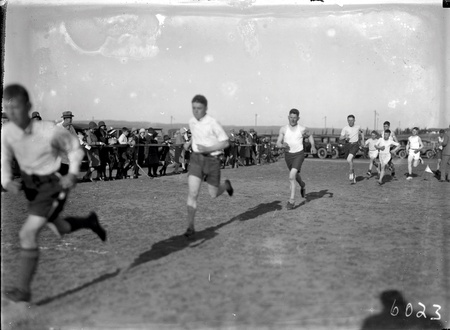 A race in progress at the Canberra Grammar School Sports Day at Manuka Oval.