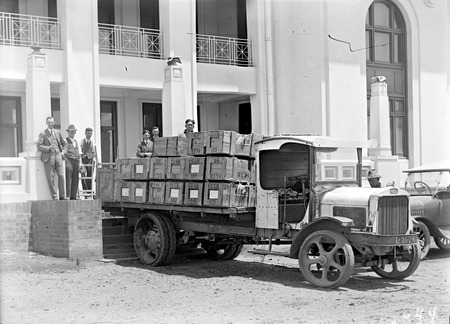 Arrival of National Library books at Parliament House on a White truck - People include Harold L White and K Binns