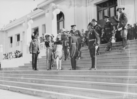 Governor General, Lord Stonehaven, and his party meeting senior service officers on the steps of Parliament House for the opening of the 12th Parliament.