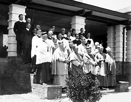 Group of Roman Catholic clergy including Archbishop Mannix in front of Hotel Canberra