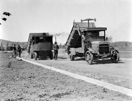 Thorneycroft and a Foden steam tipping trucks.