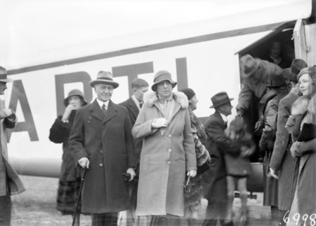 Visit of Imperial Airways Airliner ASTRAEA on a survey flight for proposed air mail service. Sir Isaac and Lady Isaacs beside the aircraft.