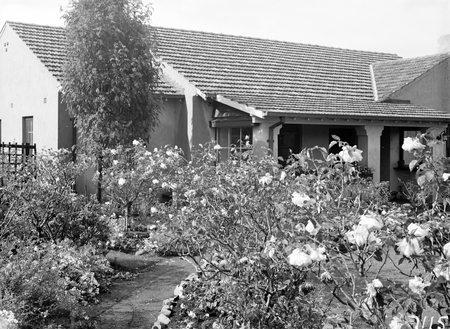House and garden built for J A Carrodus, Secretary of Dept. of Interior, 59 Dominion Circuit, Forrest. Noted for its rose garden.