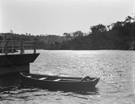 Cotter Dam from the wall with rowing boat used by the caretaker Mr. Ritter, to inspect the dam.