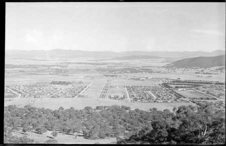 Part of Reid and Braddon from Mt Ainslie. Civic Centre and City Hill in centre. Ainslie Hotel in front.