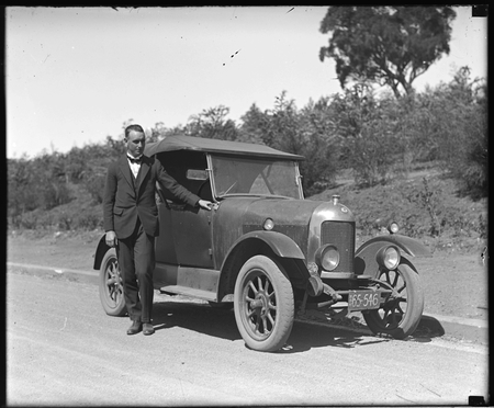 Bullnose Morris motor car with proud owner.