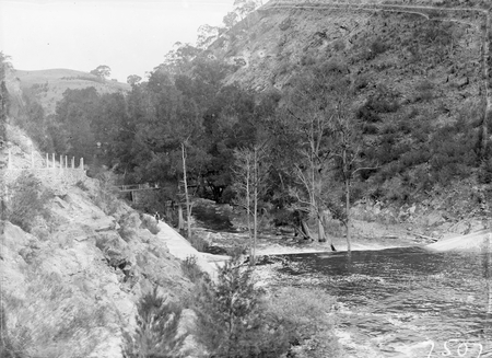Downstream from the Cotter Dam wall and stilling pond to the Cotter River.