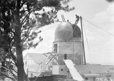 Workmen on the dome over the Farnham telescope, Commonwealth Solar Observatory, Mt Stromlo.