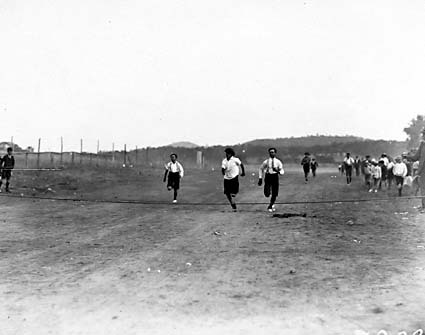 The finish of a boys race at a school sports day, Acton Sports Ground.