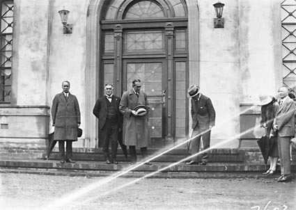 Opening of Church of England Mens Society -Prime Minister , Right Honourable SM Bruce, Sir George Pearce and Governor-General, Lord Stonehaven, at entrance to  the Australian Forestry School, Banks St., Yarralumla