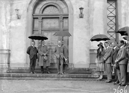 Opening of Church of England Mens Society. Prime Minister, Right Honourable SM Bruce, Sir George Pearce and Governor-General, Lord Stonehaven speaking at entrance to the Australian Forestry School, Banks St., Yarralumla.