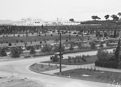 Catholic pilgrimage to Canberra - Procession of cars on Commonwealth Avenue and King George Terrace. Parliament House at the rear