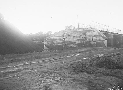Commonwealth Bridge showing flood damage with the abutments washed away