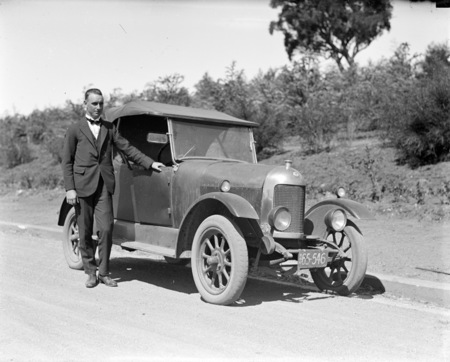 Bullnose Morris motor car with proud owner.