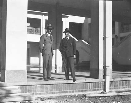 Two unidentified men in courtyard at Parliament House