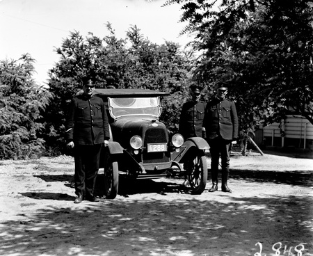 Three Policemen with motor car.