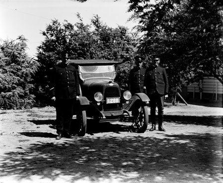 Three Policemen with motor car.
