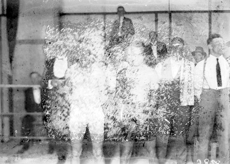 Two boxers in ring (published in CC news, April 1927).