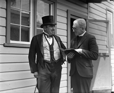 Two actors in costume in front of the bachelors quarters, published in Canberra Community News, page 6, March 1927.