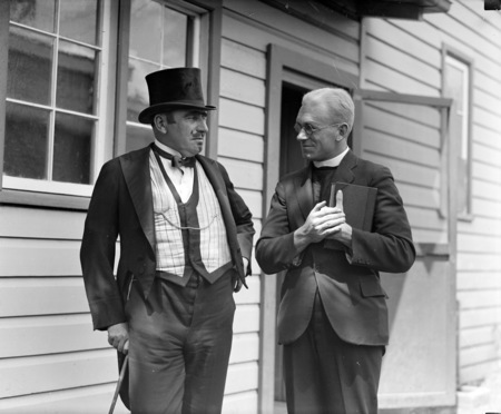 Two actors in costume in front of the bachelors quarters, published in Canberra Community News, page 6, March 1927.
