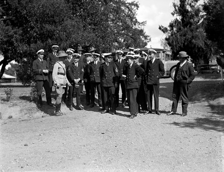 Visit to Canberra of Royal Navy Officers from HMS Renown - Officers of HMS Renown with Australian Army Officer in uniform