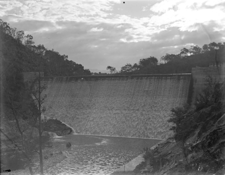 Cotter Dam wall, over flowing into the stilling pond.