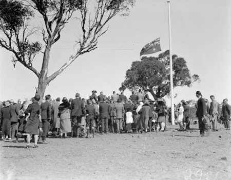 Anzac Day, 1927. View of the crowd at the ceremony showing flag at half-mast.