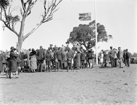 Anzac Day, 1927. View of the crowd at the ceremony showing flag at half-mast.