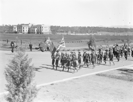 Anzac Day, 1927. View of parade showing Boy Scouts and band, East Block in background.
