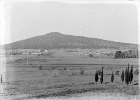 View along Ainslie Avenue from City Hill. Ainslie Hotel on left.