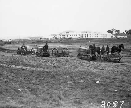 Cletrac crawler tractors towing scrapers - Landscaping in front of Parliament House