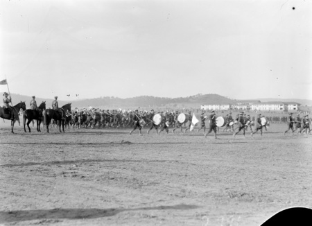 Royal Visit, May 1927. Massed Bands from the Army, Navy and Air Force passing the saluting base in Royal Review. Hotel Kurrajong in the background.