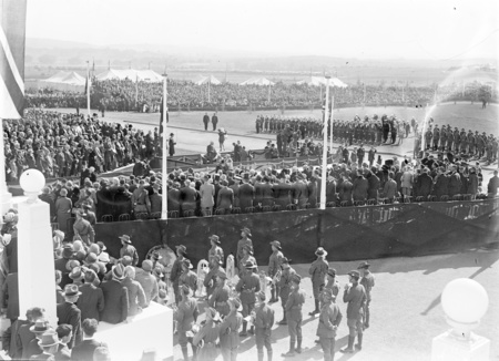 Royal Visit, May 1927. Troops, spectators and Army Band outside Parliament House and official guests clustering in front of the House.