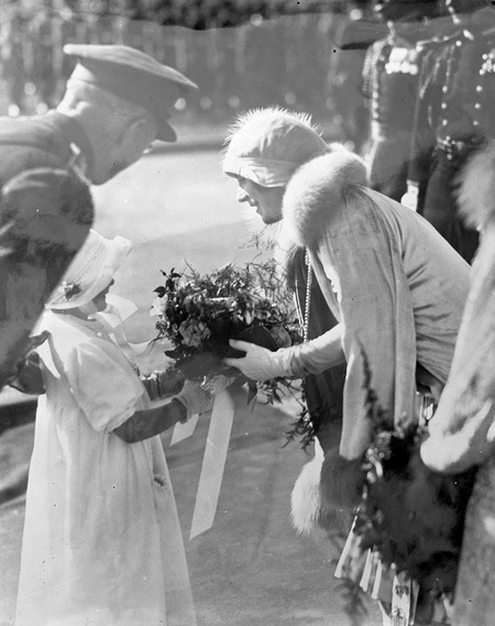 Royal Visit, May 1927. The Duchess of York receiving a bouquet from a young girl (Gwen Pinner).