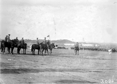 Royal Visit, May 1927 - Saluting base at the Royal Review.Duke of York on his black charger.  Hotel Kurrajong in the background