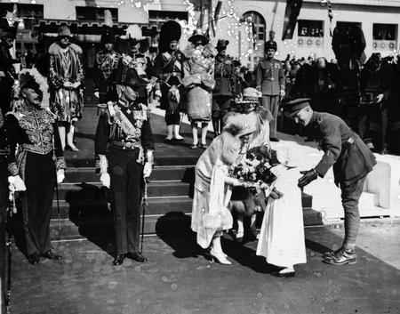 Royal Visit, May 1927. The Duchess of York receiving a bouquet from Gwen Pinner [Copy photograph].