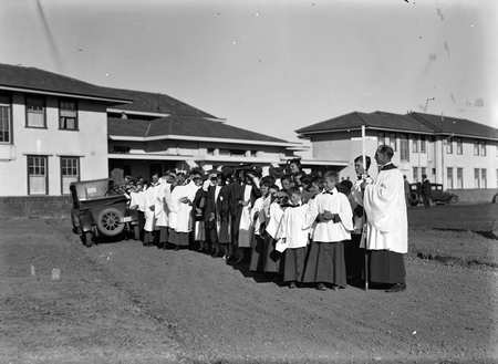 Royal Visit, May 1927. Group of clergy and choir lined up at the Hotel Canberra for dedication of site for the Anglican Cathedral.