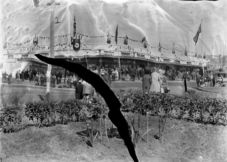 Royal Visit, May 1927. Decorations on J B Youngs Store at Kingston. Crowds awaiting the procession of the Royals.