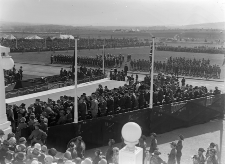 Royal Visit, May 1927. Troops, spectators and Army Band outside Parliament House with official guests in front of the House.