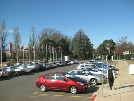 Modern day cars outside the House